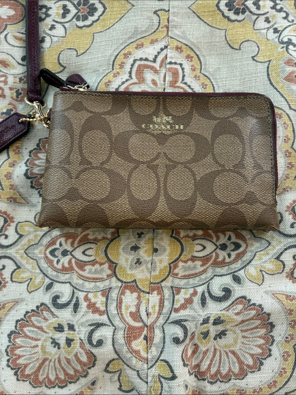Coach brown Signature Canvas Wristlet with Maroon Trim